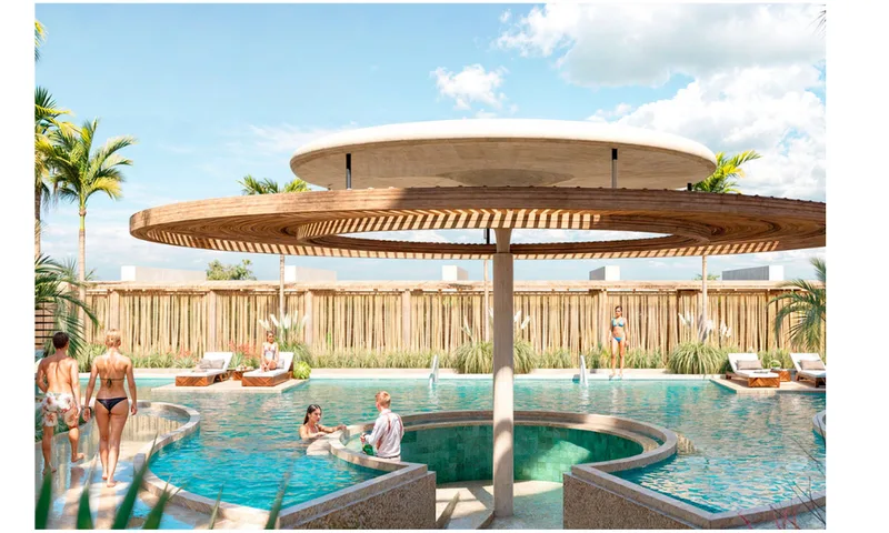 Pool bar under a circular palapa roof, with swimmers in the water